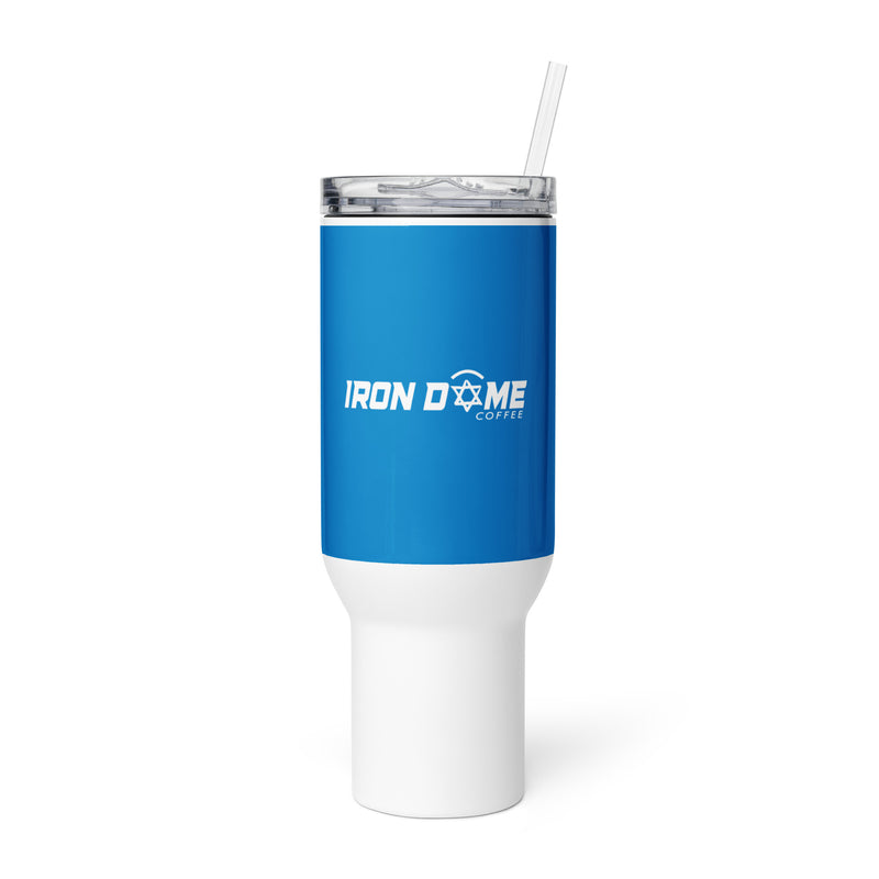 A blue travel mug with a white base and lid, featuring the Iron Dome Coffee logo, equipped with a plastic straw.